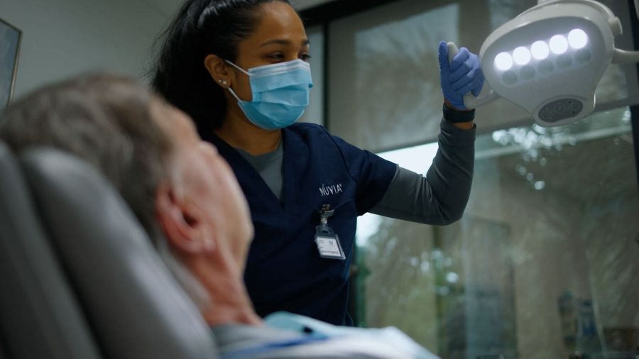 CRNA getting a patient ready for anesthesia