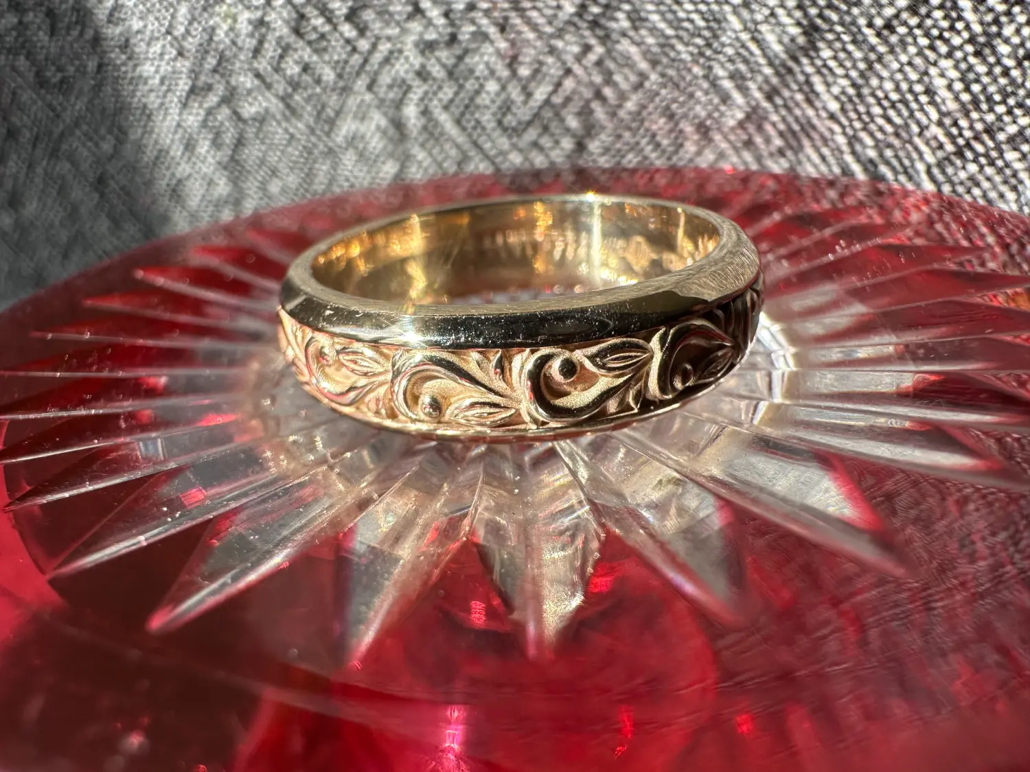 A stunning yellow diamond ring nestled within a circle of bright yellow flowers, symbolizing beauty and elegance.