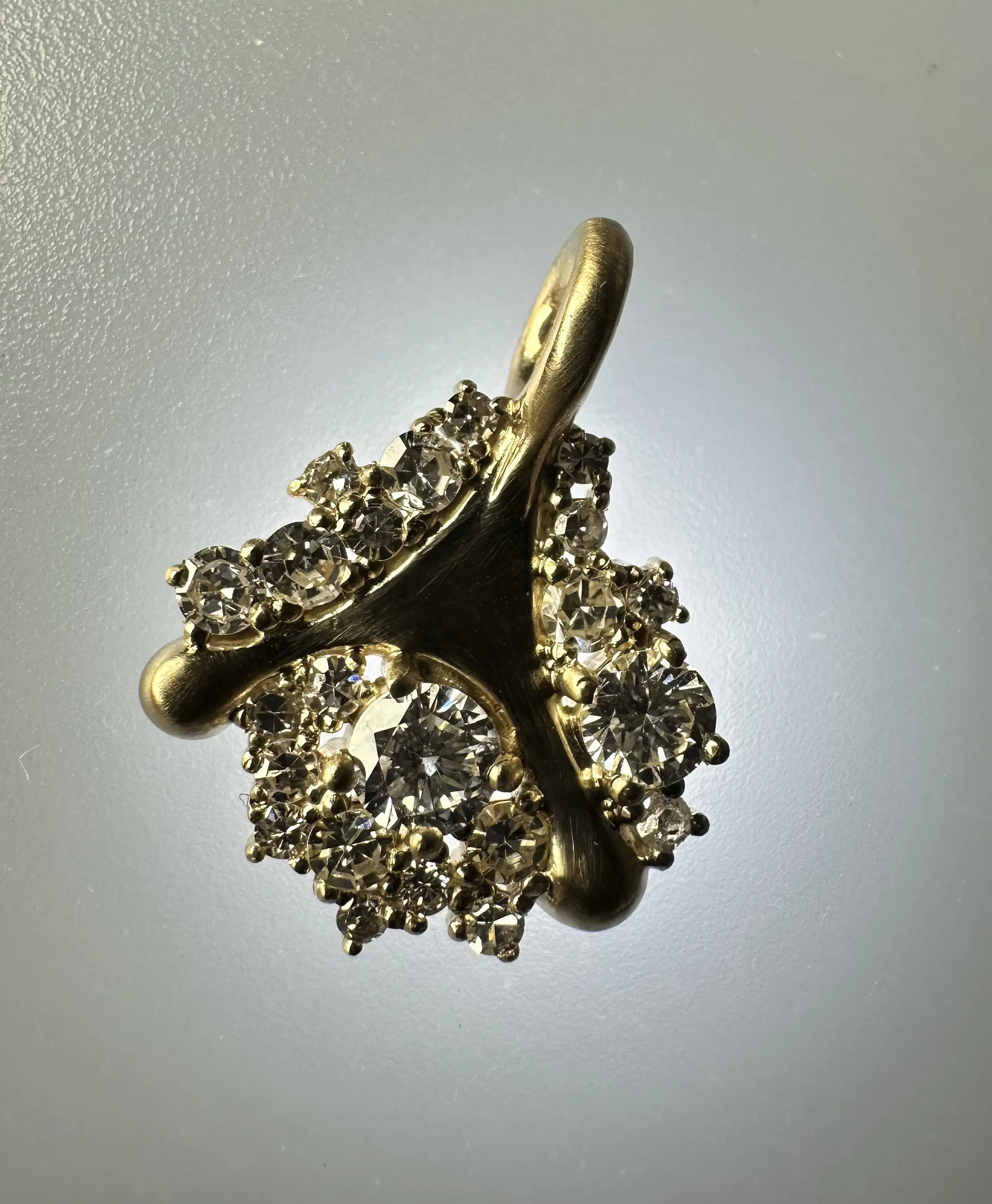 A stunning yellow diamond ring nestled within a circle of bright yellow flowers, symbolizing beauty and elegance.