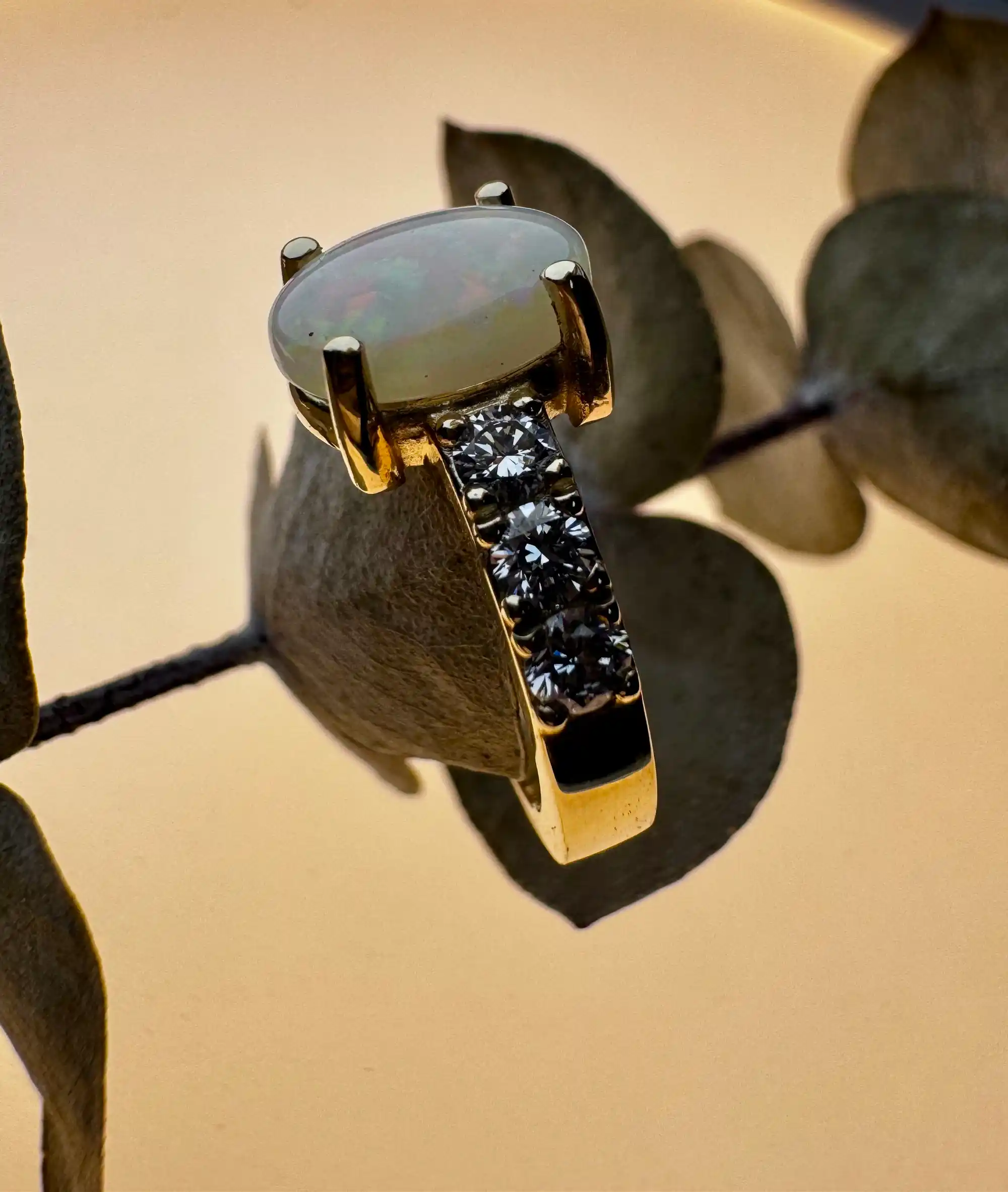 A gold ring adorned with sparkling diamonds, showcasing elegance and luxury in its design.