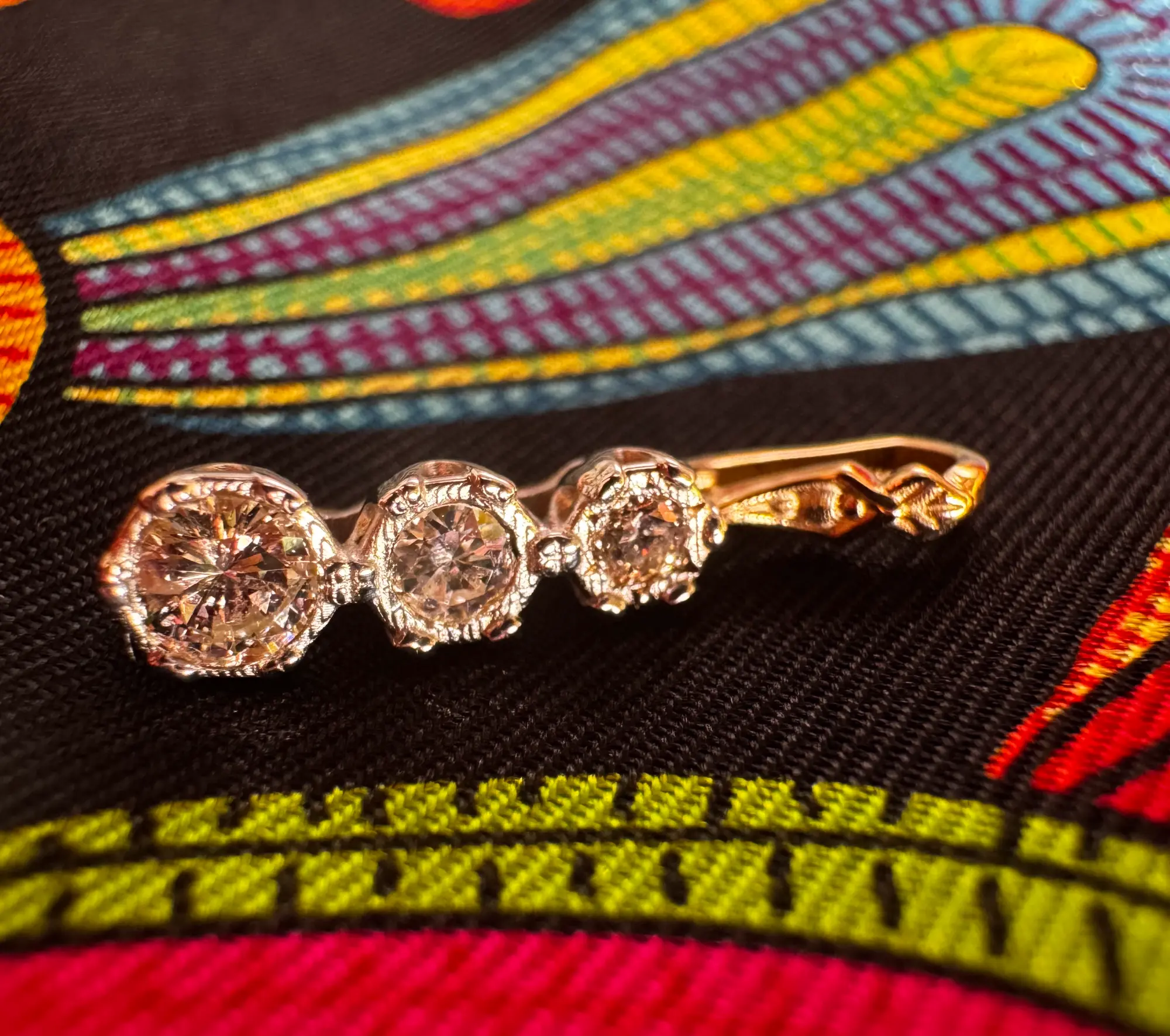 A stunning yellow diamond ring nestled within a circle of bright yellow flowers, symbolizing beauty and elegance.