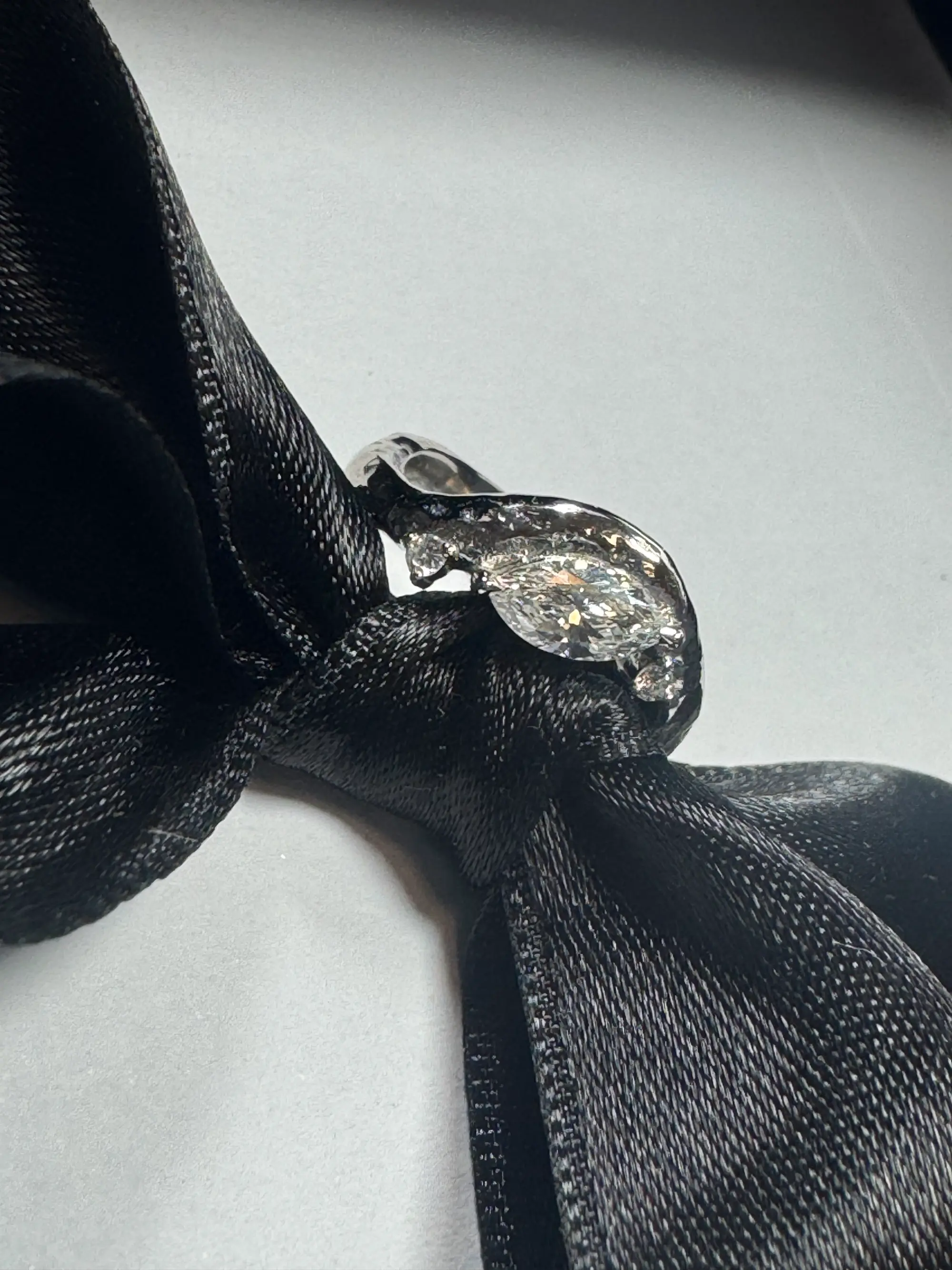 A stunning yellow diamond ring nestled within a circle of bright yellow flowers, symbolizing beauty and elegance.