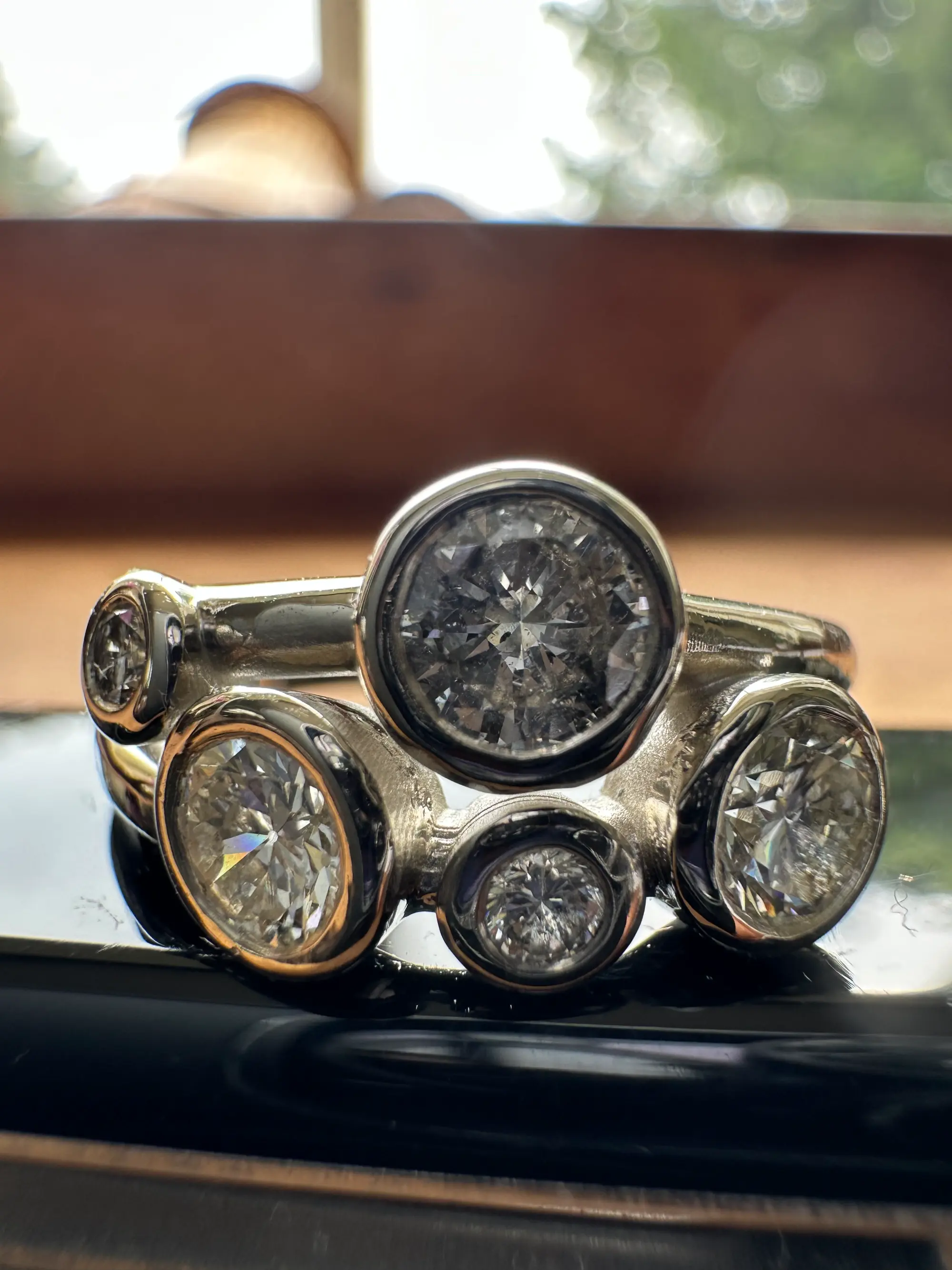 A stunning yellow diamond ring nestled within a circle of bright yellow flowers, symbolizing beauty and elegance.