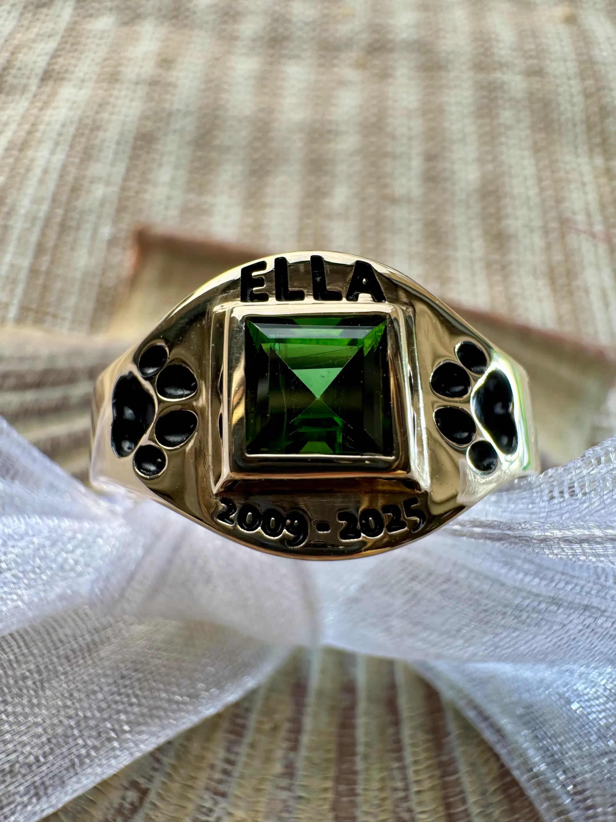 A stunning yellow diamond ring nestled within a circle of bright yellow flowers, symbolizing beauty and elegance.