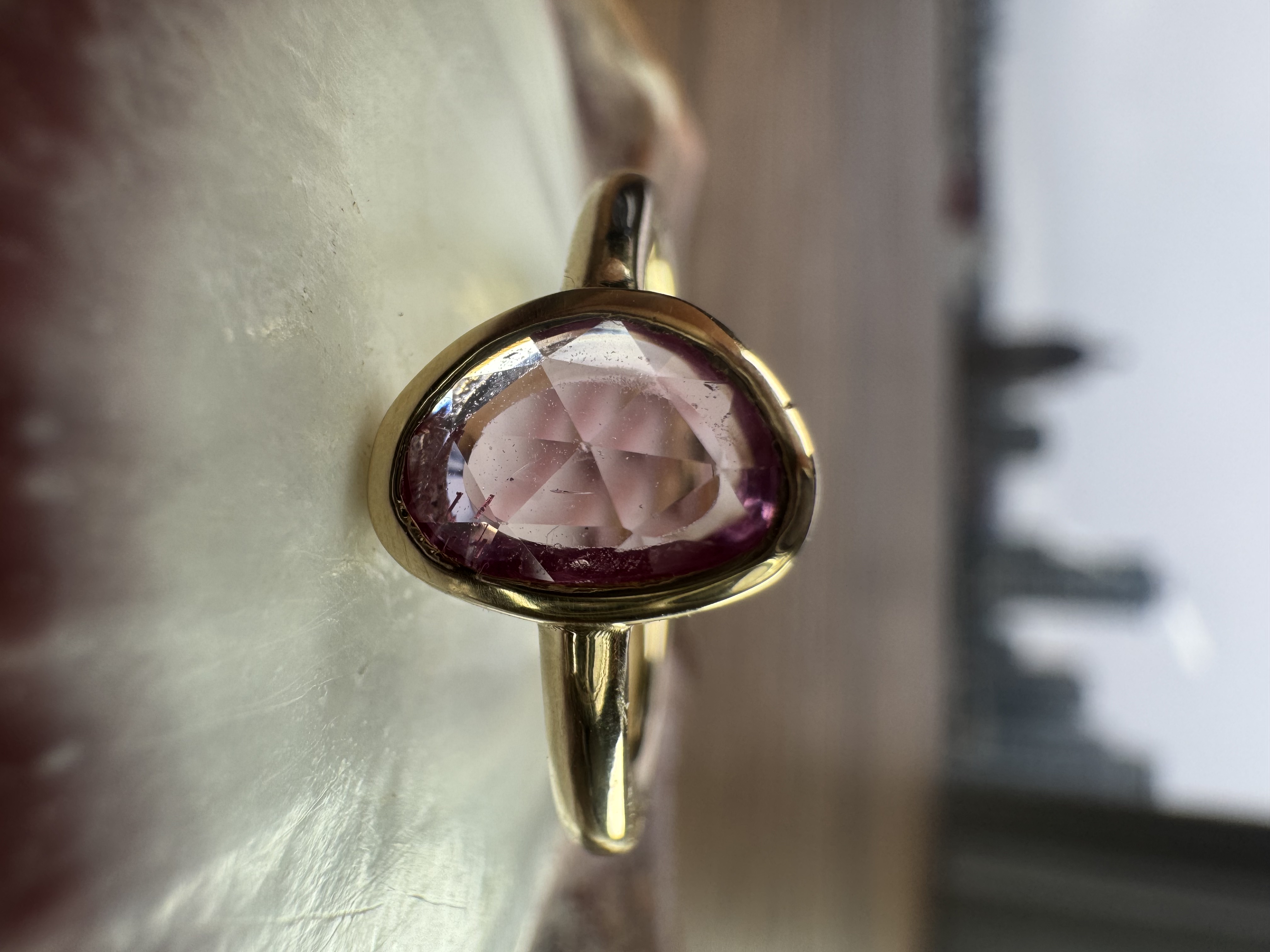 A stunning yellow diamond ring nestled within a circle of bright yellow flowers, symbolizing beauty and elegance.