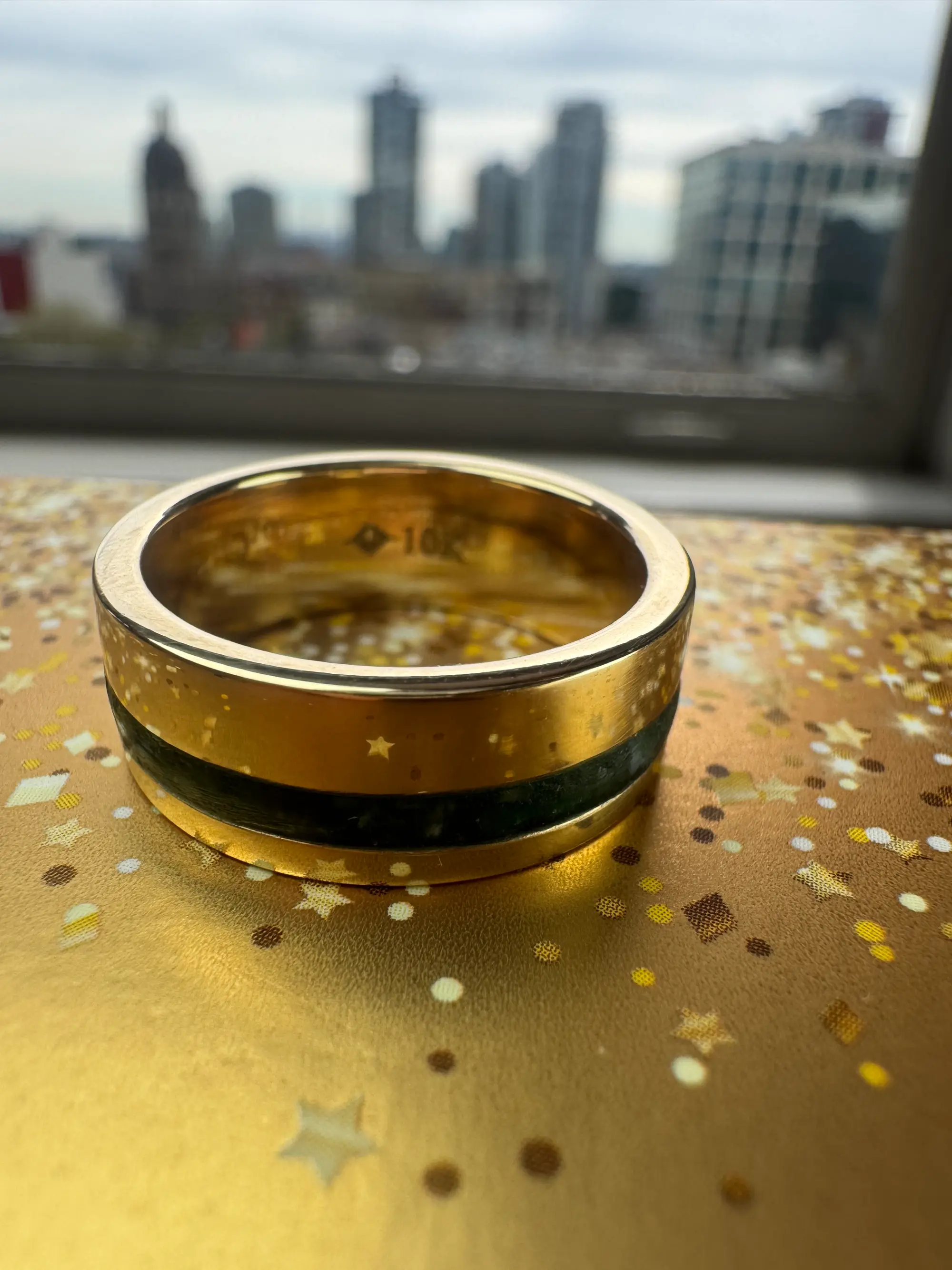 A stunning yellow diamond ring nestled within a circle of bright yellow flowers, symbolizing beauty and elegance.