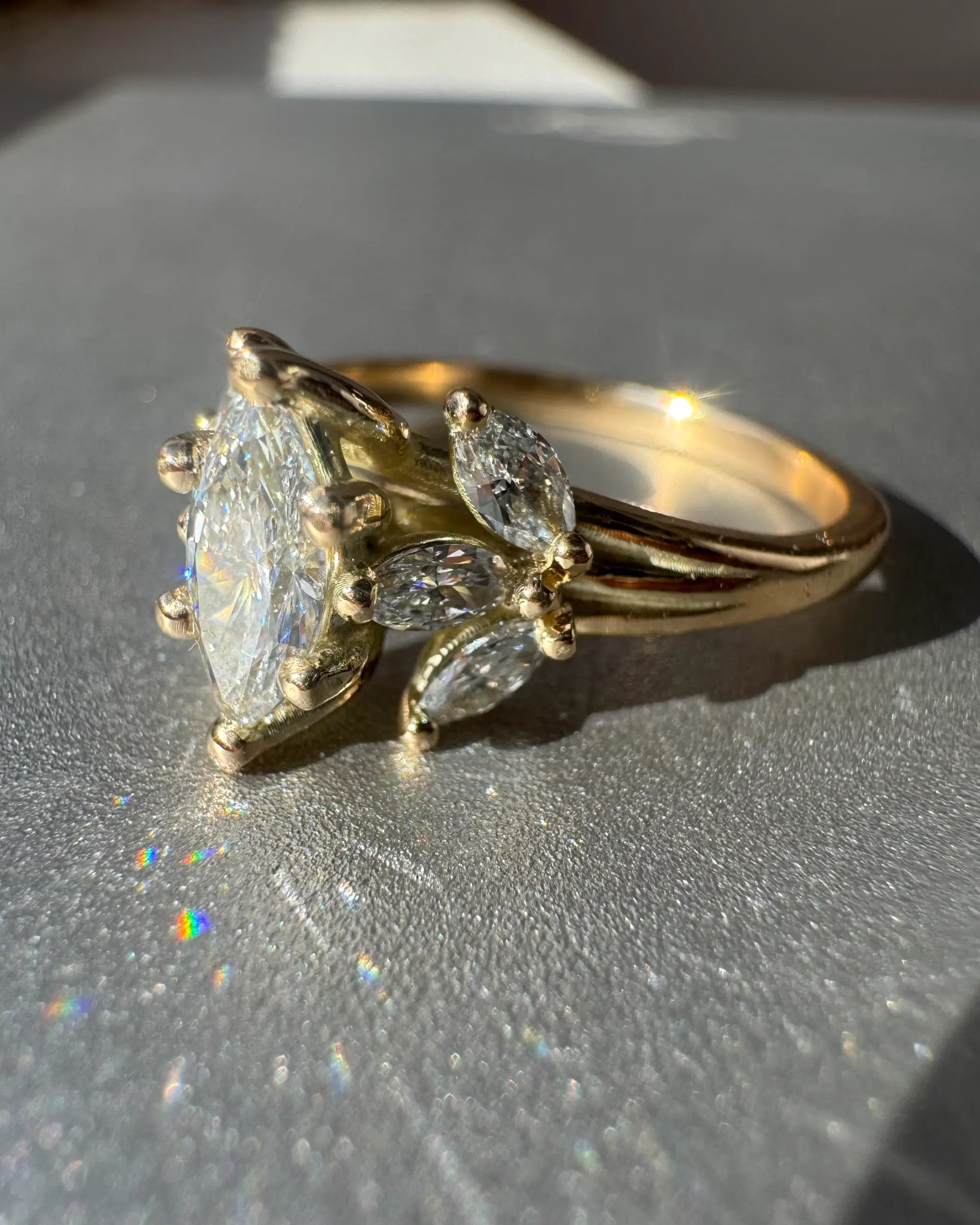 A stunning yellow diamond ring nestled within a circle of bright yellow flowers, symbolizing beauty and elegance.