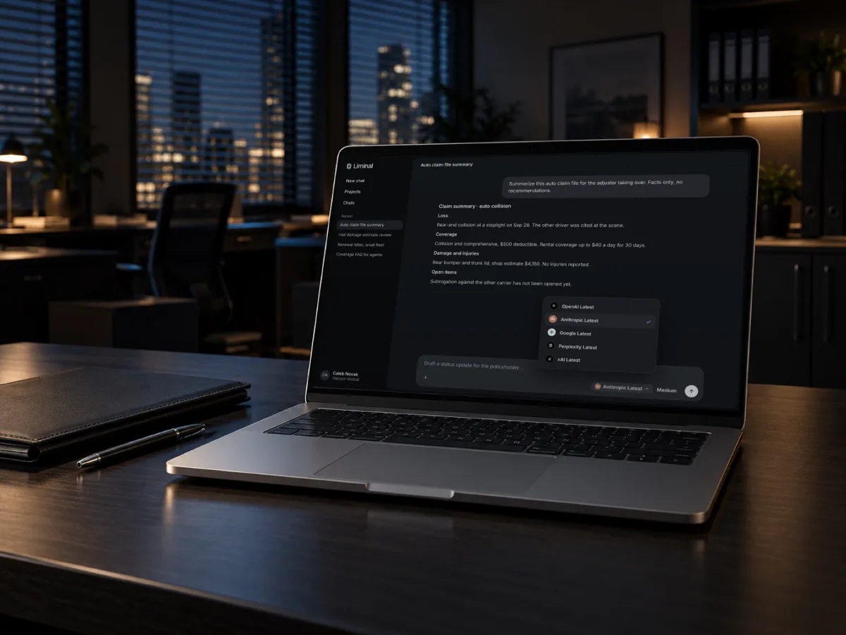 Laptop on an office desk at night showing an auto claim file summary in Liminal