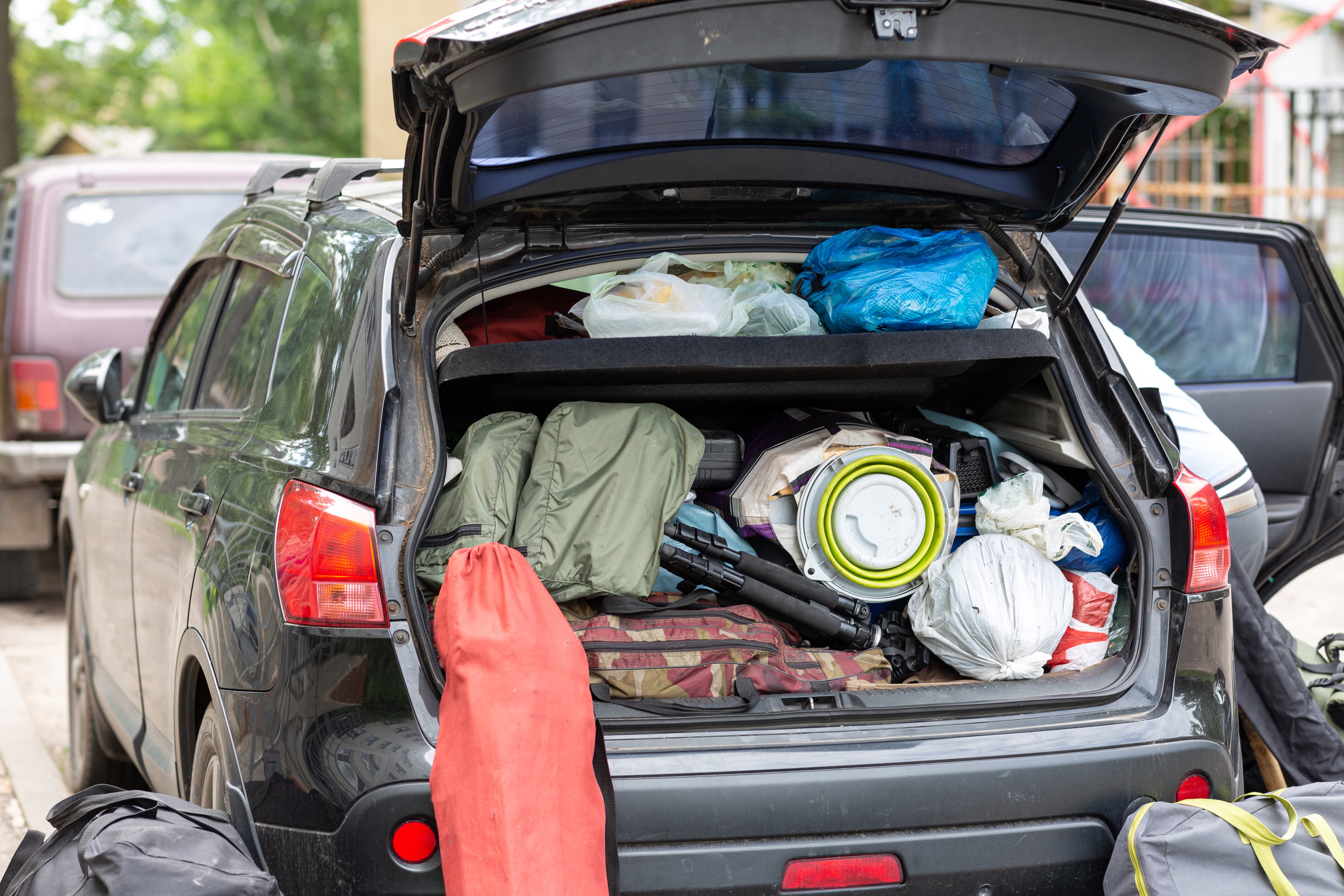 SUV with a trunk packed full with camping gear