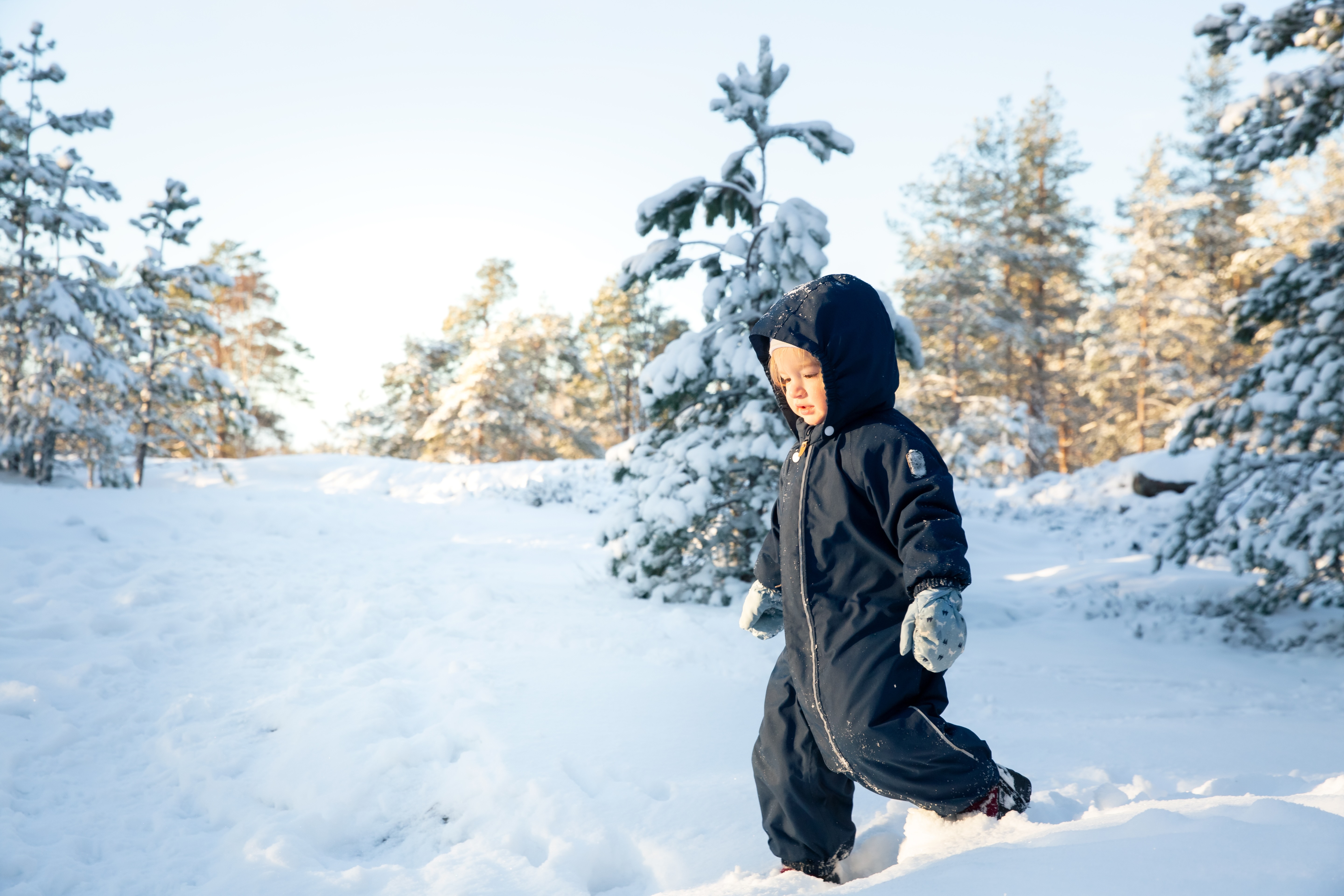 Child dressed up and bundled for snow outside