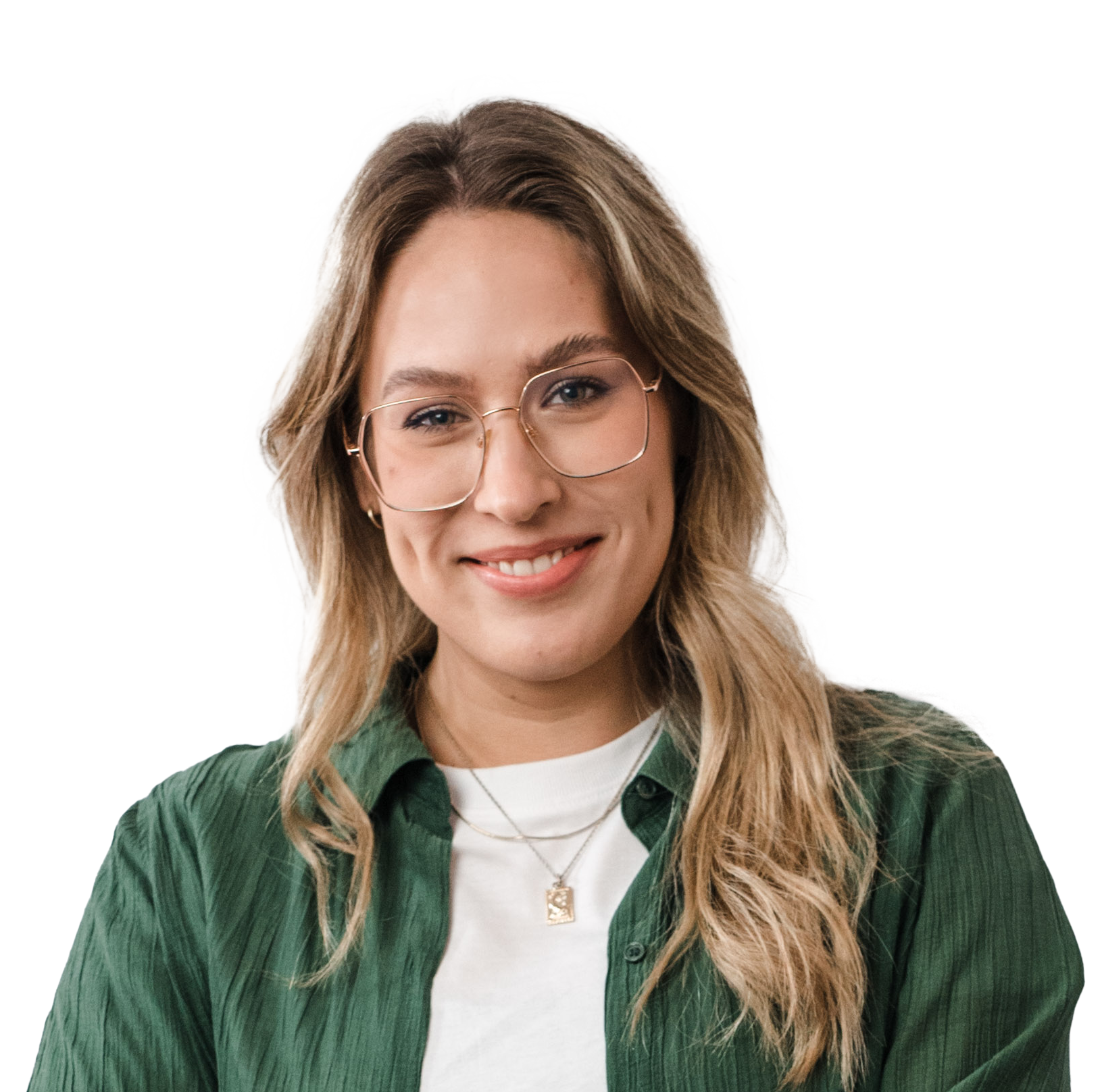 Portrait of a smiling woman wearing glasses, a green button-up shirt, and a pendant necklace against a white background.