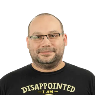 Headshot of a man wearing glasses and a black shirt with yellow text that reads "DISAPPOINTED I AM"