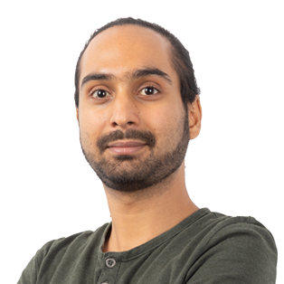 Headshot of a man with dark hair and beard wearing a olive green shirt against a white background