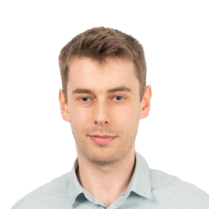 Headshot of a young man with light brown hair wearing a light blue button-up shirt against a white background.