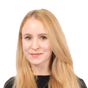 Professional headshot of a woman with long strawberry blonde hair wearing a black top against a white background.