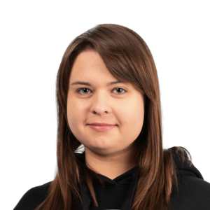 Professional headshot of a woman with long brown hair wearing a black top against a white background.