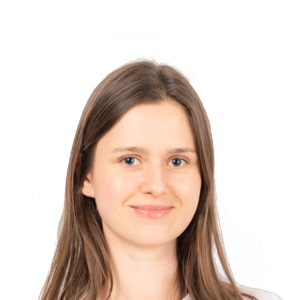 Headshot of a young woman with long brown hair, smiling at the camera against a white background.