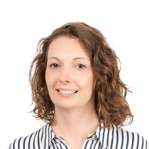 Headshot of a smiling woman with shoulder-length wavy brown hair wearing a striped shirt against a white background.