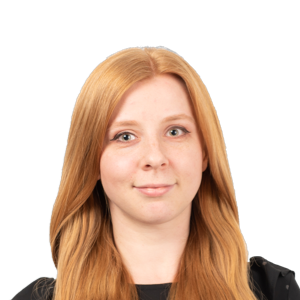 Portrait photograph of a woman with long reddish-auburn hair wearing a dark top against a white background.