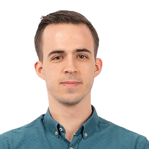 Headshot of a young man with brown hair wearing a teal button-up shirt against a white background.
