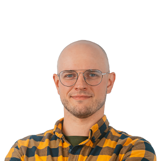 Bald man wearing glasses and a yellow and black checkered shirt, smiling at camera against white background