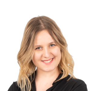 Professional headshot of a smiling woman with shoulder-length blonde hair wearing a black top against a white background.