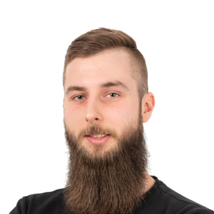 Portrait of a man with a long dark beard wearing a black shirt against a white background.