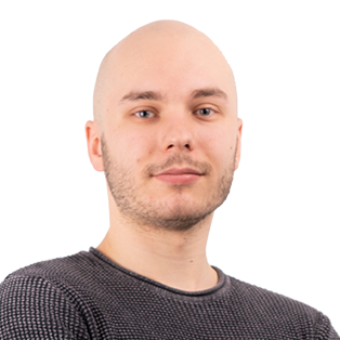 Headshot of a bald man with facial hair wearing a dark gray textured shirt against a white background.