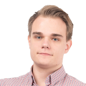 Professional headshot of a young man with light brown hair wearing a pink checkered shirt against a white background.