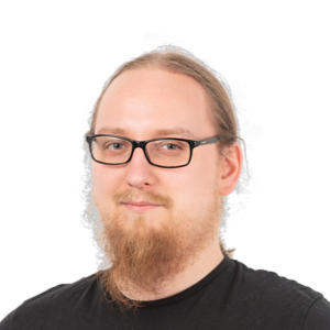 Headshot of a man with glasses, beard, and reddish-blonde hair wearing a black shirt against a white background.