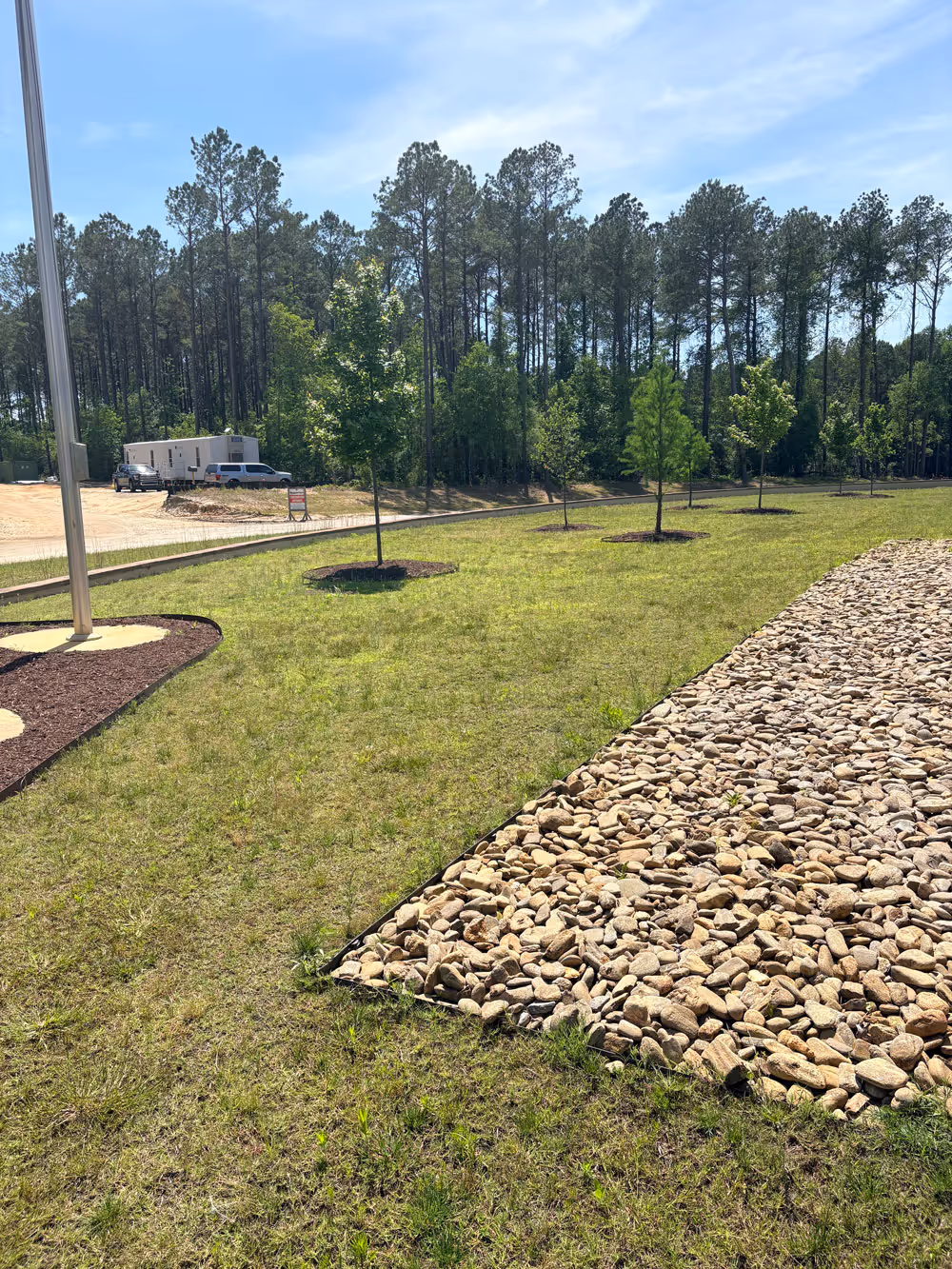 A lawn before lawn maintenance by Elite Turf Services.