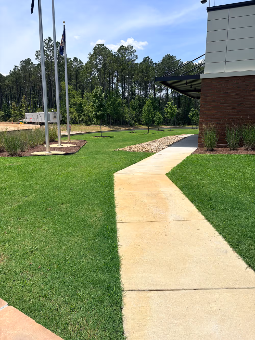 A lawn after lawn maintenance by Elite Turf Services looking vibrant, healthy, and refreshed.