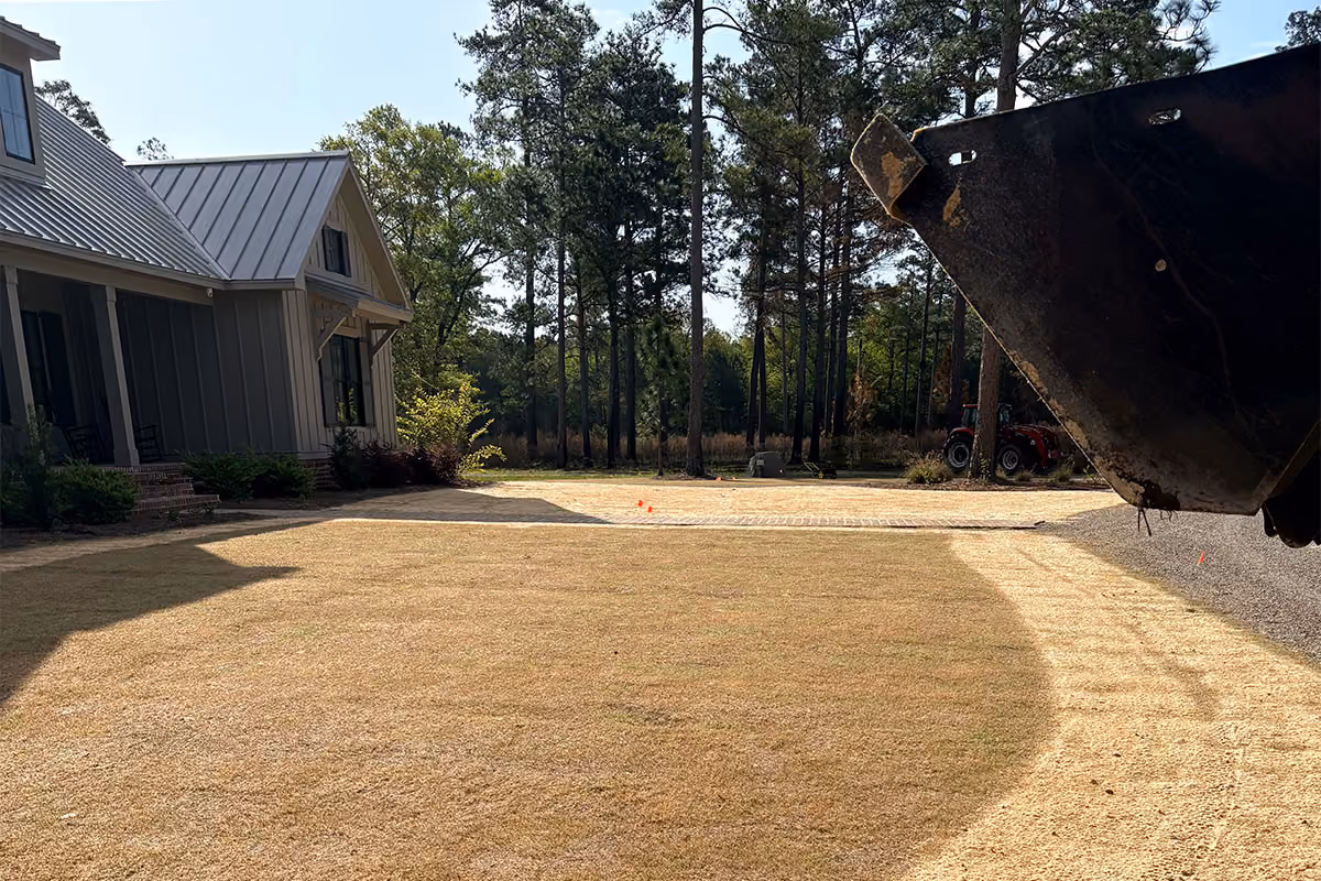 In the process of compost topdressing a South Carolina yard.
