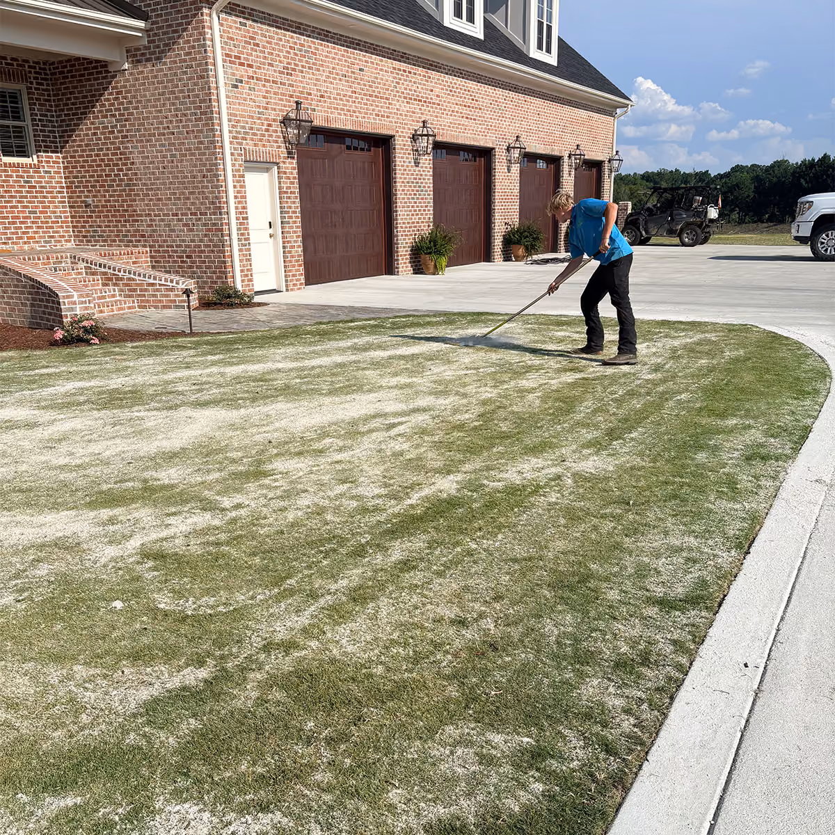 Residential compost topdressing in progress.