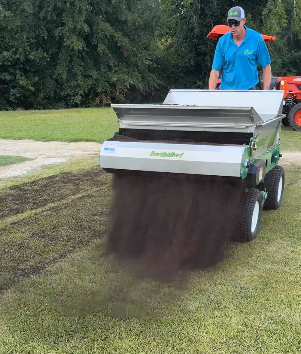 Elite Turf providing compost topdressing with specialized equipment.