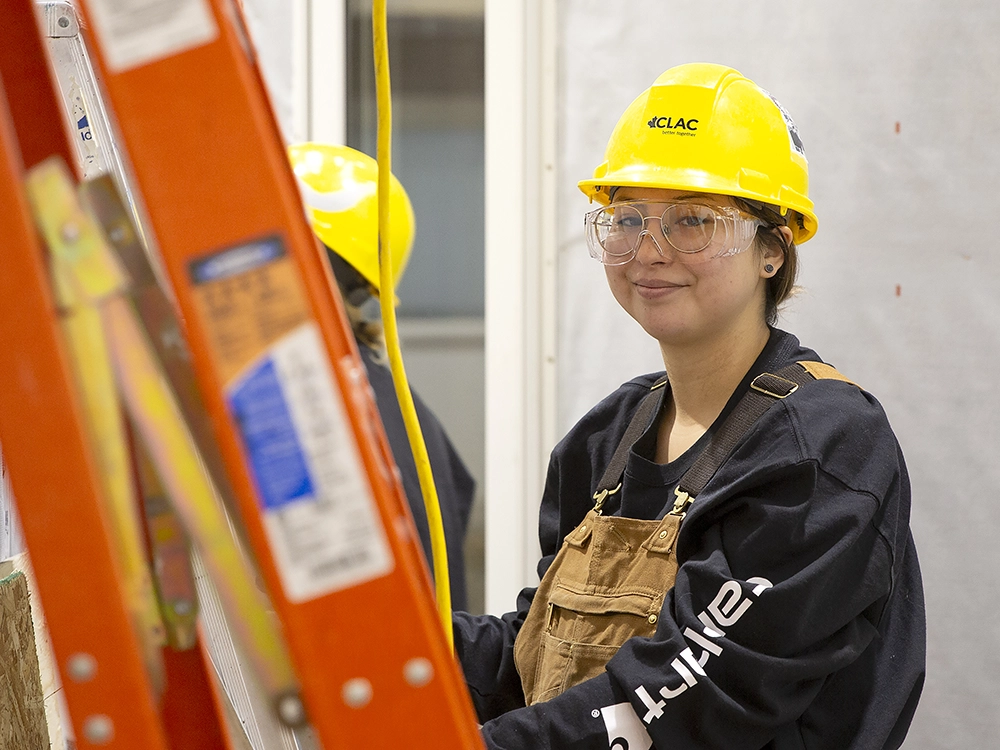 An indigenous teenager learning how to be an apprentice.