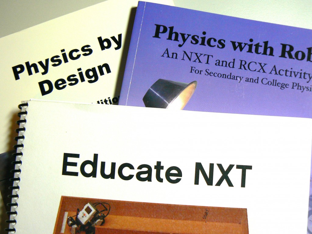 pile of books about NXT