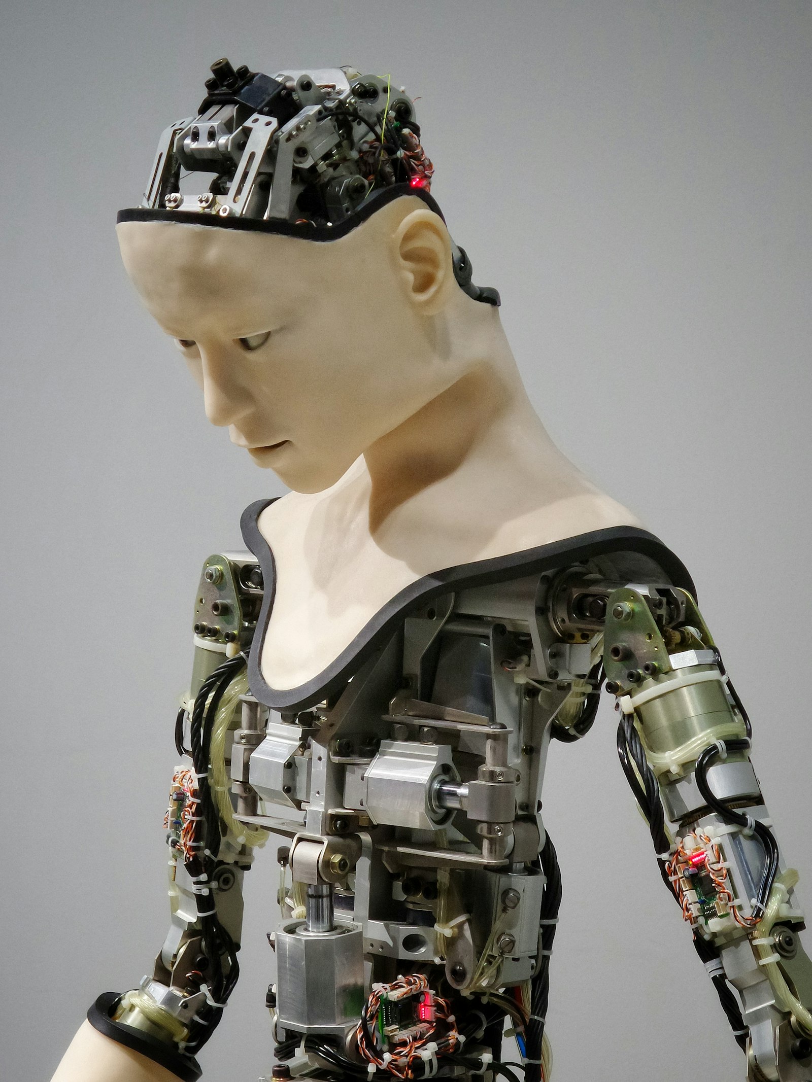 Close-up of a white humanoid robot face representing artificial intelligence agents and enterprise automation technology
