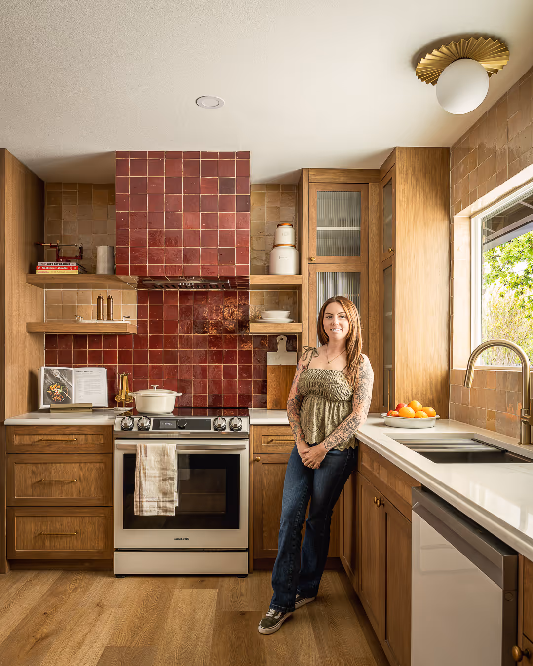 Recently remodeled modern kitchen with wooden cabinets and red tile backsplash, South Austin.