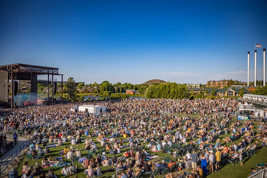 Afternoon view of sold-out Slightly Stoopid concert at Hayden Homes Amphitheater with Old MIll District Stacks in the back