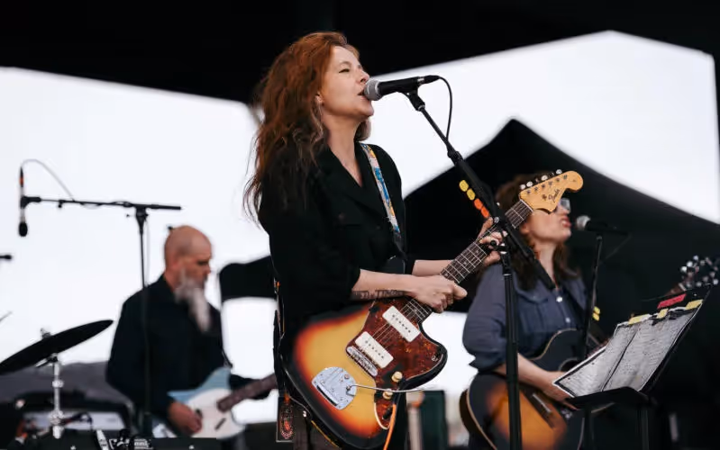 Photo of Neko Case singing during her 2018 performance