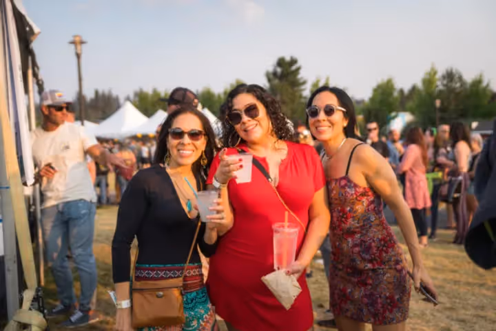 Group of gals cheers drinks at Dirty Heads Concert