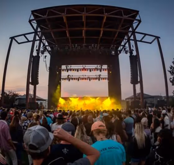 Photo of Hayden Homes Amphitheater stage lit up with crowd cheering