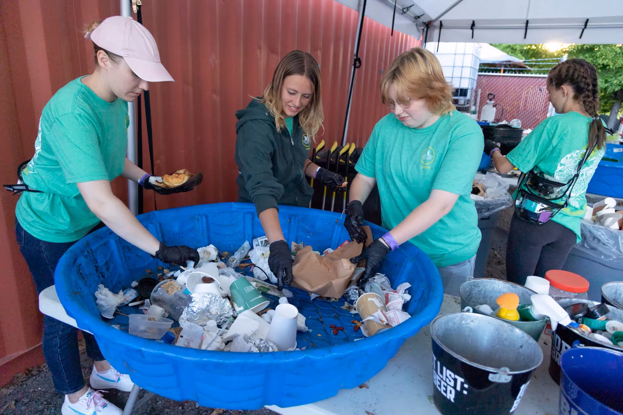 Green Team members sort through waste after a run of shows at Hayden Homes Amphitheater