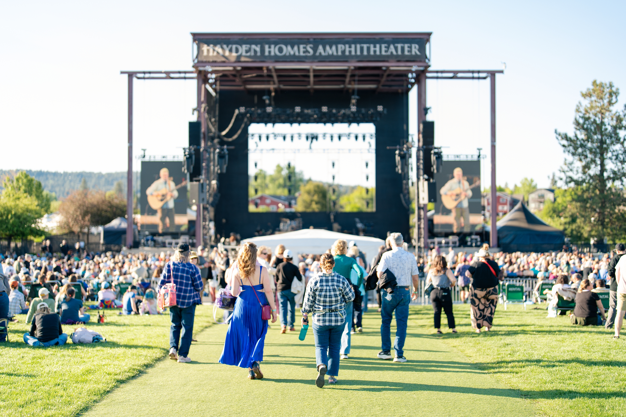View of Hayden Homes Amphitheater stage in Bend, Oregon with fans approaching the stage.