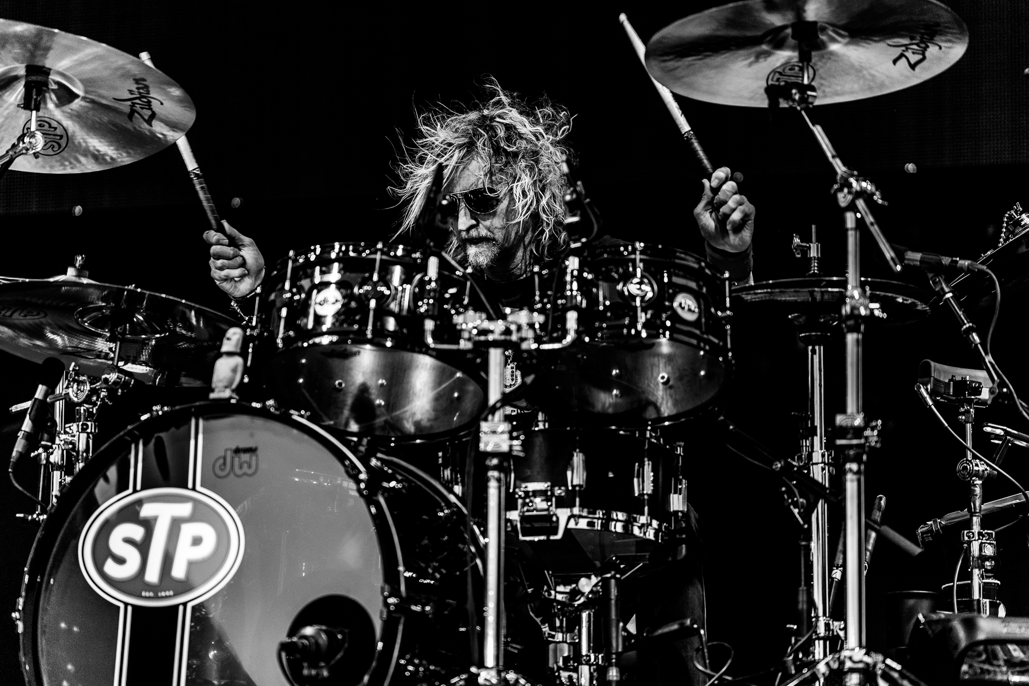 Stone Temple Pilots drummer Eric Kretz on stage smashing the drums at Hayden Homes Amphitheater in Bend, Oregon.