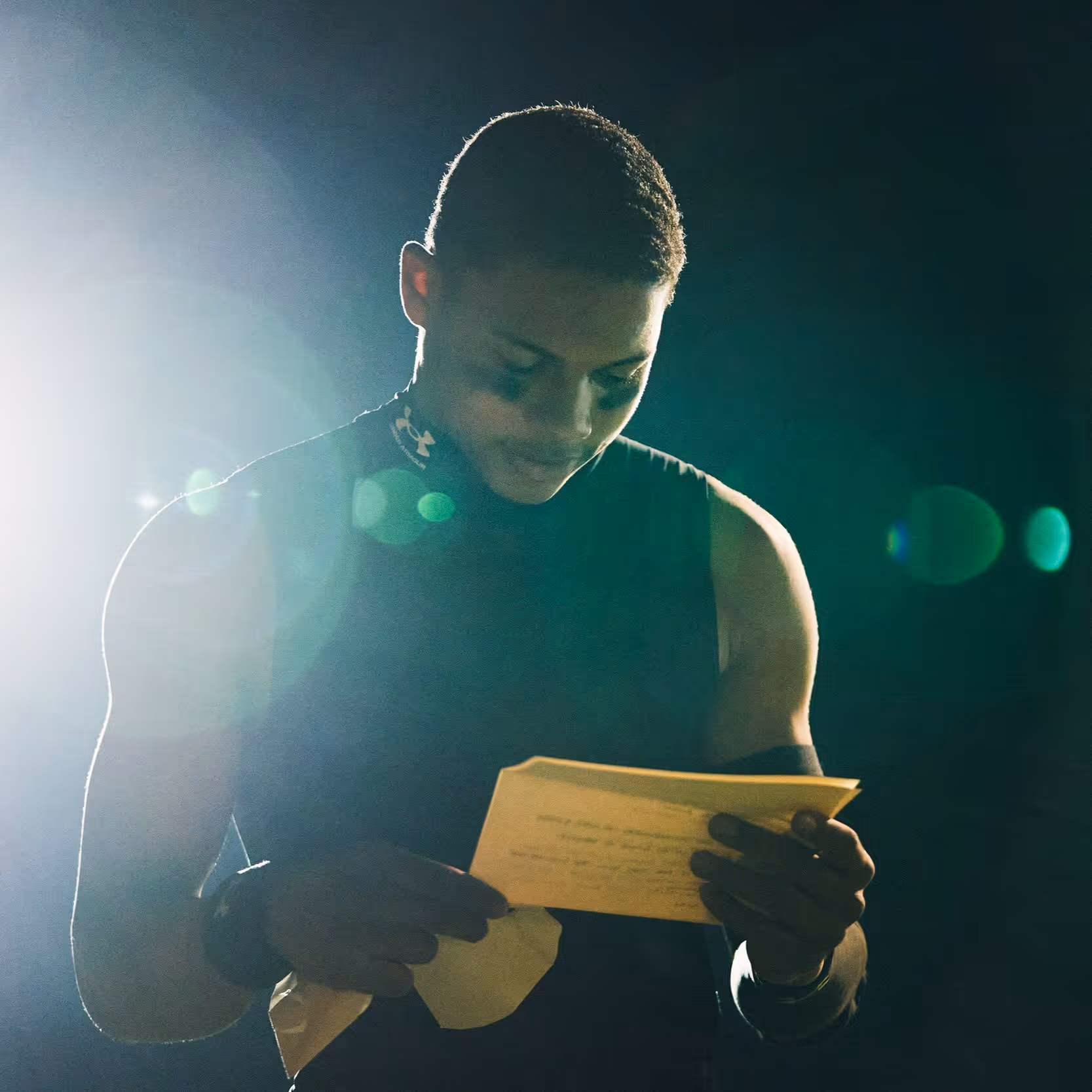 A man holding a piece of paper in his hands
