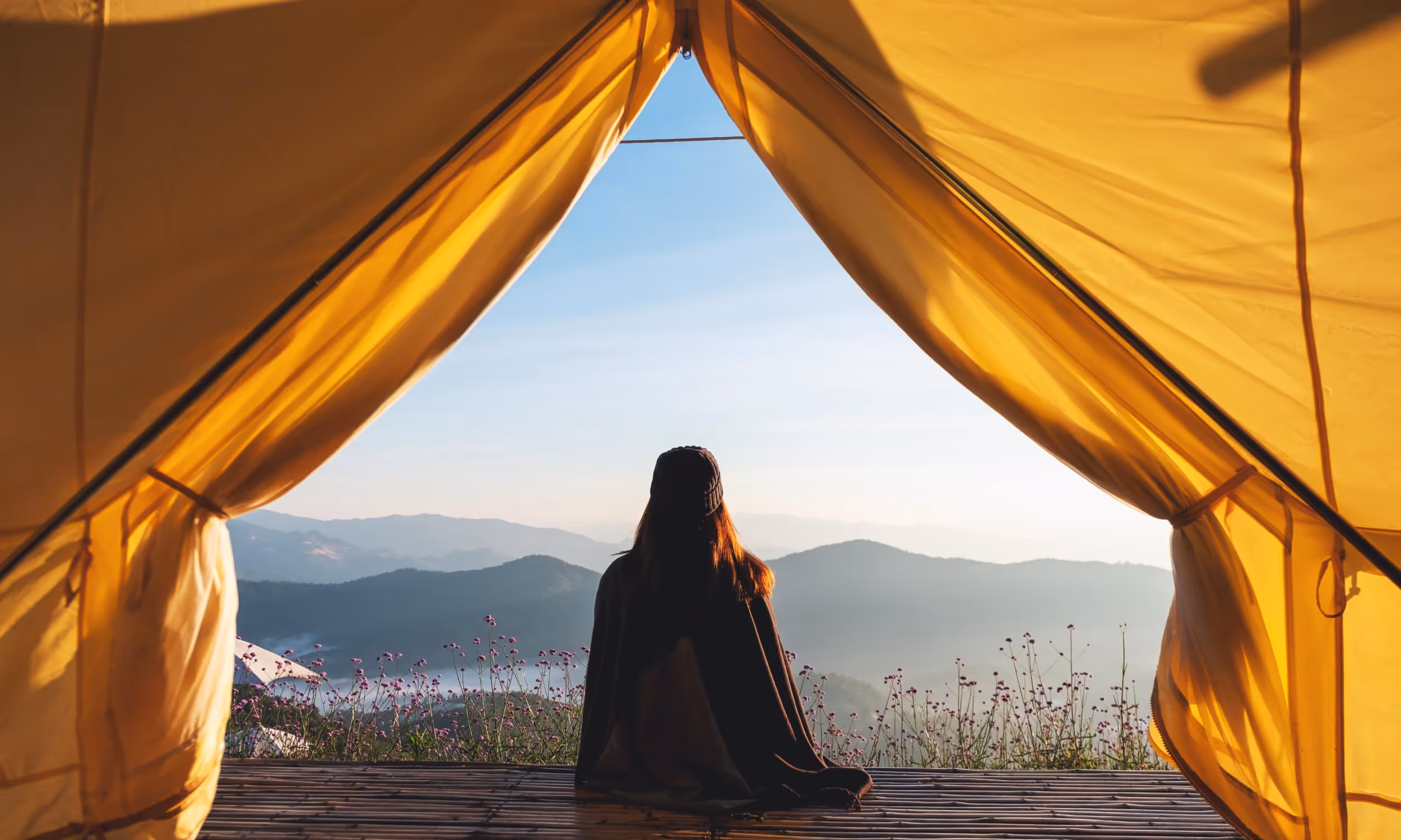 Looking out airplane window at the wing and cloudy sky