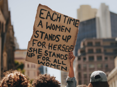 image of a speaker at a humanitarian aid fundraising event, delivering an inspiring presentation