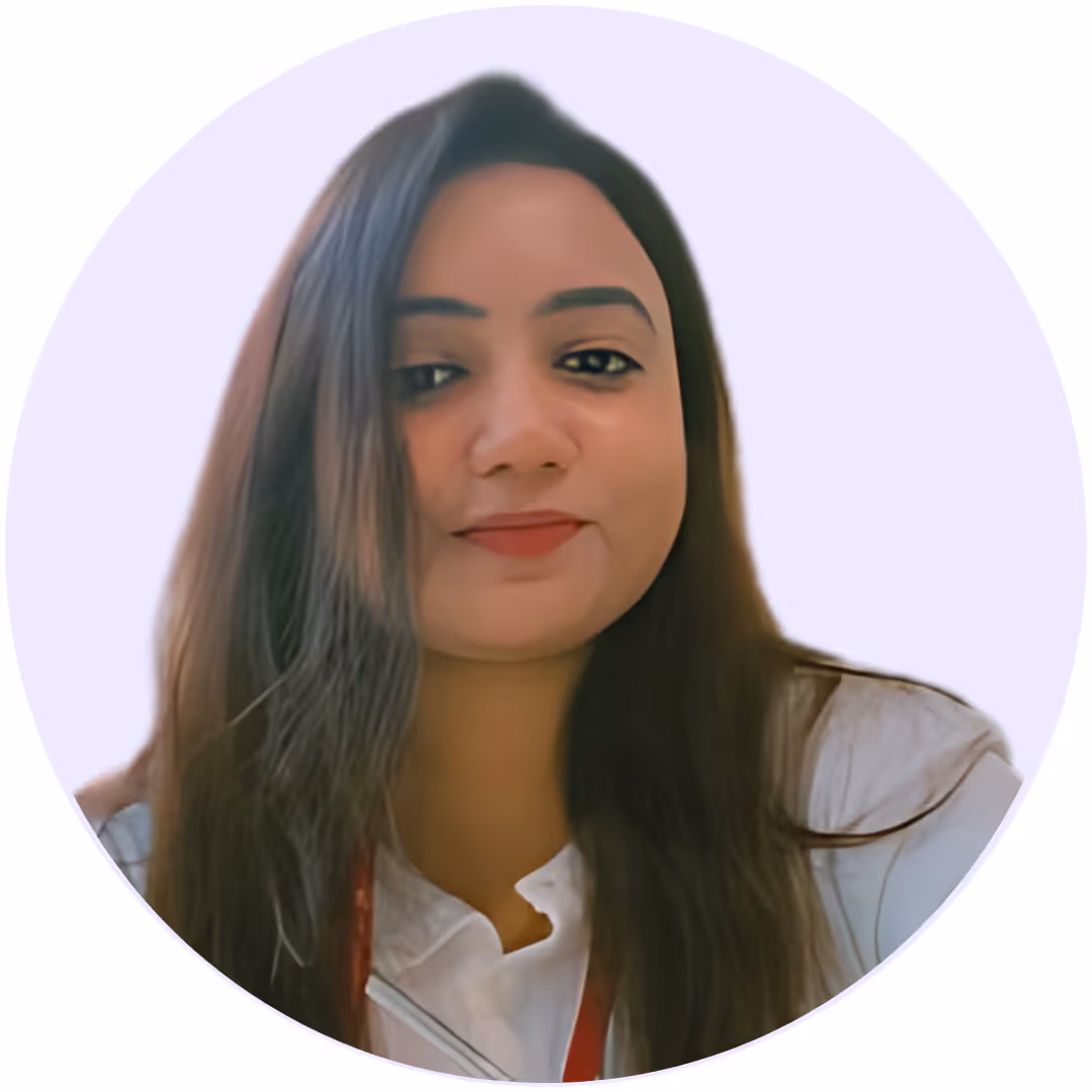 Woman with long dark hair wearing a white shirt and a red lanyard against a pale purple background.